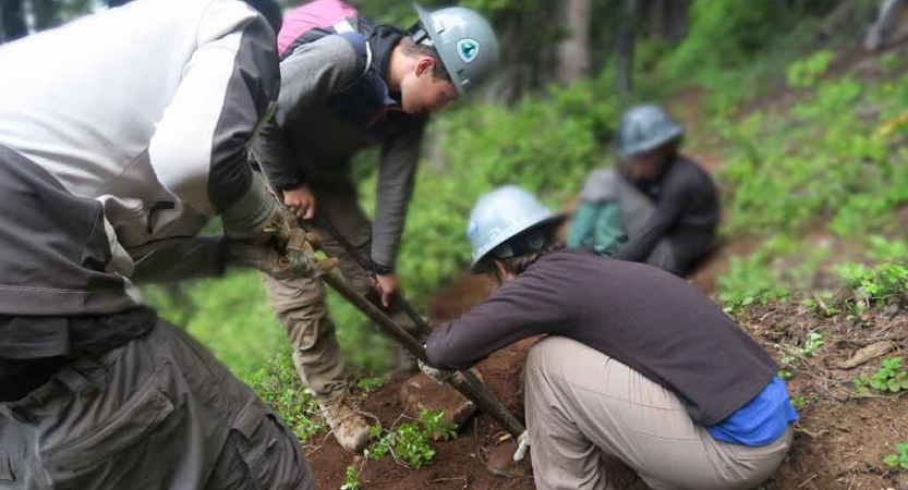 teens work on service project on outward bound expedition